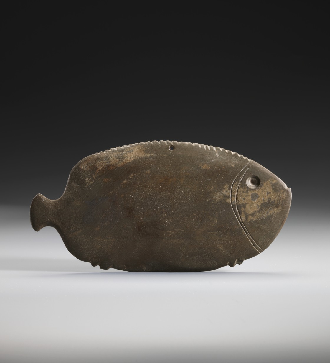 <em>Predynastic cosmetic palette shaped as a fish</em>